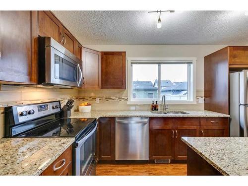 73 Silverado Drive Sw, Calgary, AB - Indoor Photo Showing Kitchen With Stainless Steel Kitchen With Double Sink