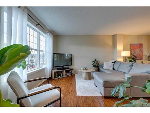 73 Silverado Drive Sw, Calgary, AB - Indoor Photo Showing Living Room