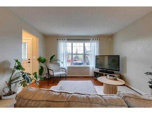 73 Silverado Drive Sw, Calgary, AB - Indoor Photo Showing Living Room