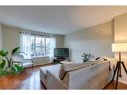 73 Silverado Drive Sw, Calgary, AB - Indoor Photo Showing Living Room