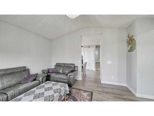 56 Tararidge Drive Ne, Calgary, AB - Indoor Photo Showing Living Room