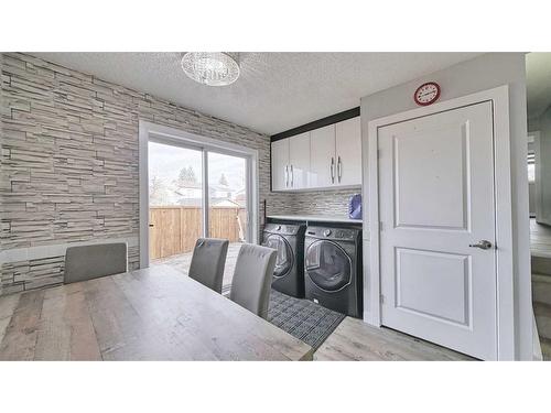 56 Tararidge Drive Ne, Calgary, AB - Indoor Photo Showing Laundry Room