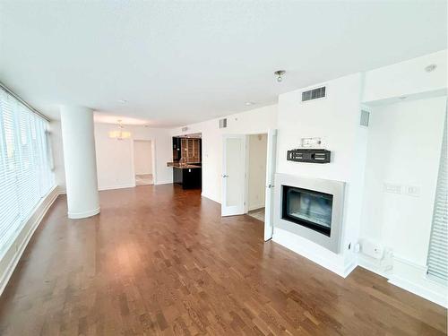 707-888 4 Avenue Sw, Calgary, AB - Indoor Photo Showing Living Room With Fireplace