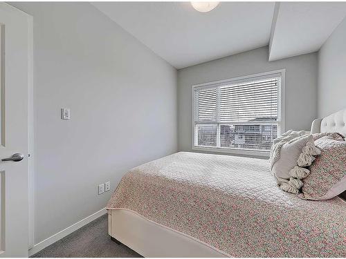 318-4350 Seton Drive Se, Calgary, AB - Indoor Photo Showing Bedroom