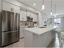 318-4350 Seton Drive Se, Calgary, AB  - Indoor Photo Showing Kitchen With Stainless Steel Kitchen With Double Sink With Upgraded Kitchen 