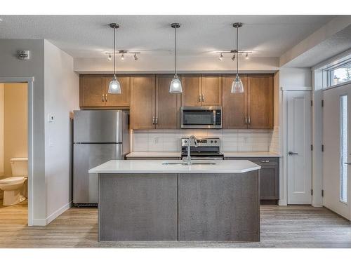 12-30 Shawnee Common Sw, Calgary, AB - Indoor Photo Showing Kitchen With Double Sink