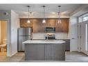 12-30 Shawnee Common Sw, Calgary, AB  - Indoor Photo Showing Kitchen With Double Sink 