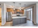 12-30 Shawnee Common Sw, Calgary, AB  - Indoor Photo Showing Kitchen With Stainless Steel Kitchen With Double Sink 