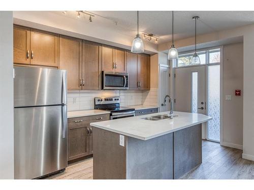 12-30 Shawnee Common Sw, Calgary, AB - Indoor Photo Showing Kitchen With Stainless Steel Kitchen With Double Sink With Upgraded Kitchen