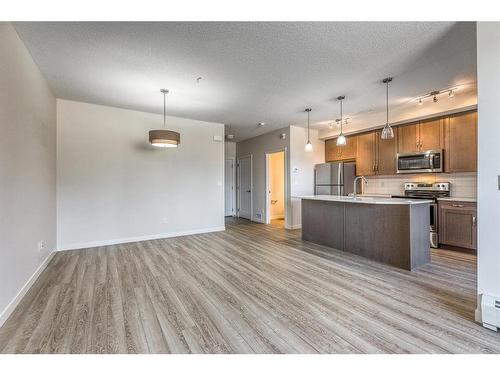 12-30 Shawnee Common Sw, Calgary, AB - Indoor Photo Showing Kitchen With Stainless Steel Kitchen