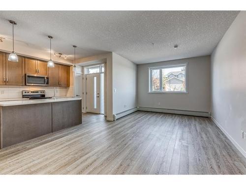 12-30 Shawnee Common Sw, Calgary, AB - Indoor Photo Showing Kitchen