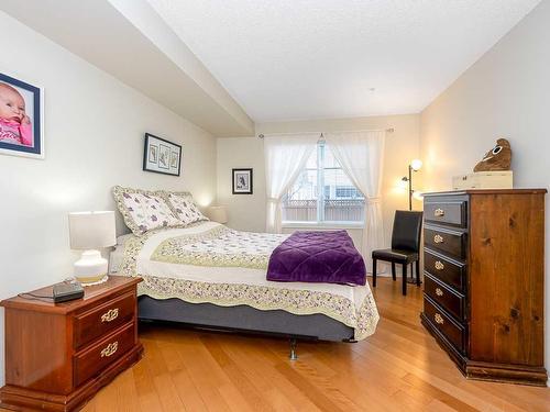 1111-200 Community, Okotoks, AB - Indoor Photo Showing Bedroom