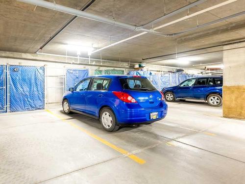 1111-200 Community, Okotoks, AB - Indoor Photo Showing Garage