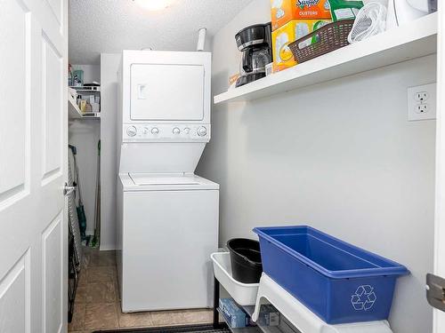 1111-200 Community, Okotoks, AB - Indoor Photo Showing Laundry Room