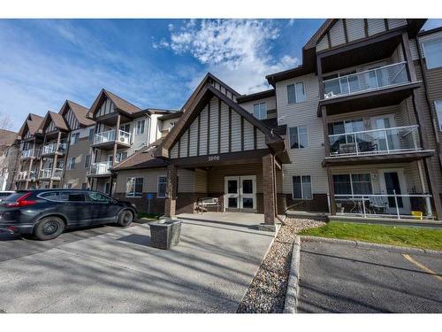 1111-200 Community, Okotoks, AB - Outdoor With Facade