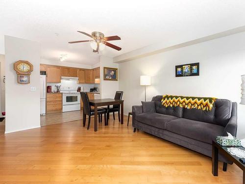 1111-200 Community, Okotoks, AB - Indoor Photo Showing Living Room