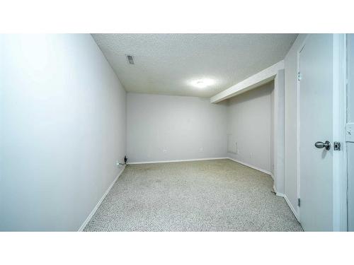 100-630 Sabrina Road Sw, Calgary, AB - Indoor Photo Showing Other Room