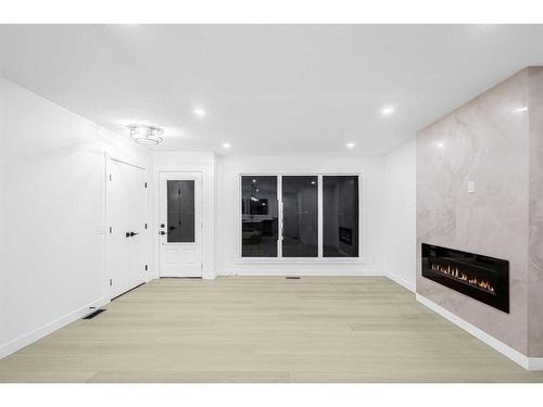 7915 Huntington Street Ne, Calgary, AB - Indoor With Fireplace