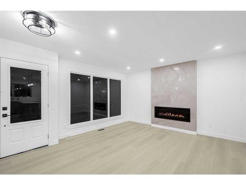 7915 Huntington Street Ne, Calgary, AB - Indoor With Fireplace