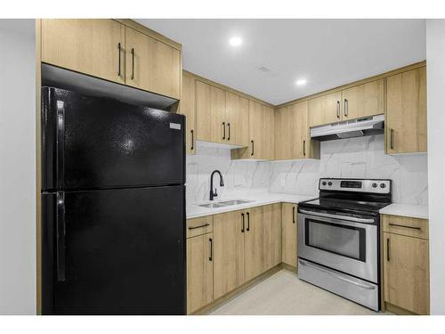 7915 Huntington Street Ne, Calgary, AB - Indoor Photo Showing Kitchen With Double Sink