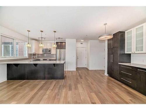 303-836 Royal Avenue Sw, Calgary, AB - Indoor Photo Showing Kitchen With Stainless Steel Kitchen With Upgraded Kitchen