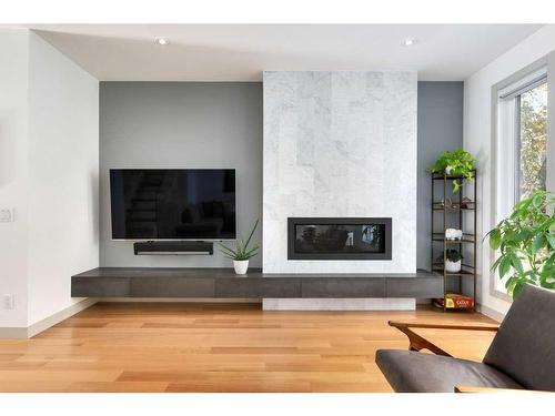 1431 Gladstone Road Nw, Calgary, AB - Indoor Photo Showing Living Room With Fireplace