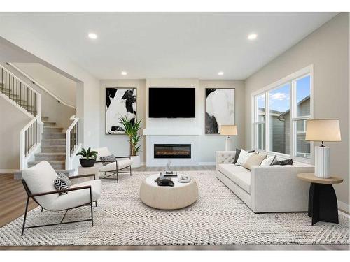 44 Verity Place Sw, Calgary, AB - Indoor Photo Showing Living Room With Fireplace