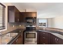 2401-60 Panatella Street Nw, Calgary, AB  - Indoor Photo Showing Kitchen With Double Sink 