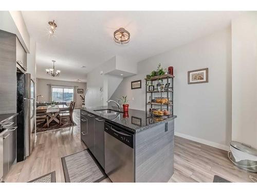 2406 Jumping Pound Common, Cochrane, AB - Indoor Photo Showing Kitchen With Stainless Steel Kitchen With Upgraded Kitchen