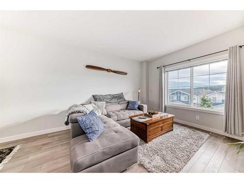 2406 Jumping Pound Common, Cochrane, AB - Indoor Photo Showing Living Room