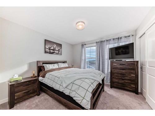 2406 Jumping Pound Common, Cochrane, AB - Indoor Photo Showing Bedroom