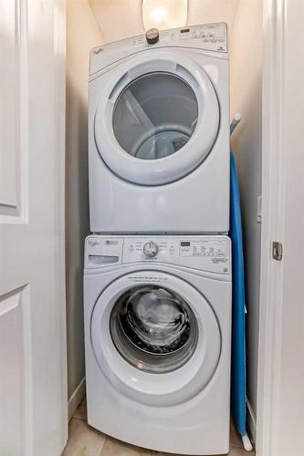 2406 Jumping Pound Common, Cochrane, AB - Indoor Photo Showing Laundry Room