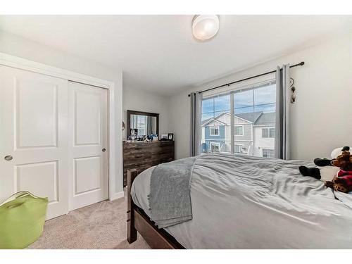 2406 Jumping Pound Common, Cochrane, AB - Indoor Photo Showing Bedroom