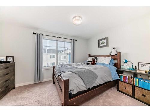 2406 Jumping Pound Common, Cochrane, AB - Indoor Photo Showing Bedroom