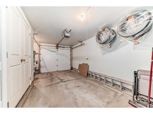 2406 Jumping Pound Common, Cochrane, AB - Indoor Photo Showing Garage