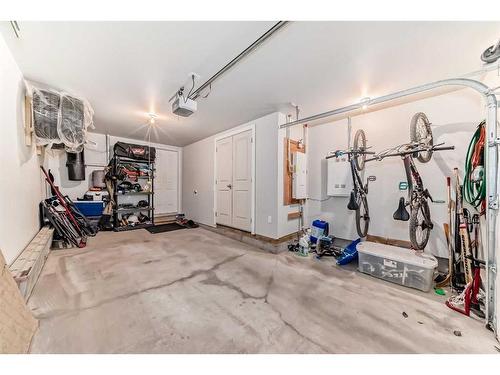 2406 Jumping Pound Common, Cochrane, AB - Indoor Photo Showing Garage