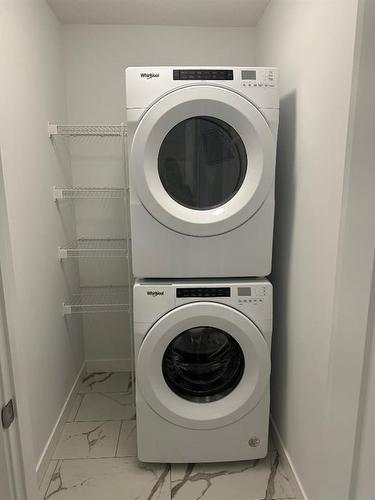 372 Carringvue Place Nw, Calgary, AB - Indoor Photo Showing Laundry Room