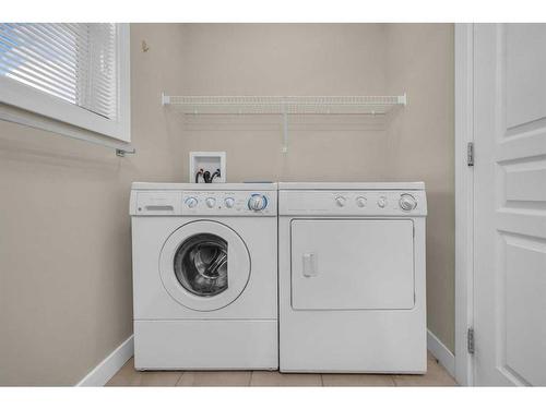 113 Panatella Road Nw, Calgary, AB - Indoor Photo Showing Laundry Room