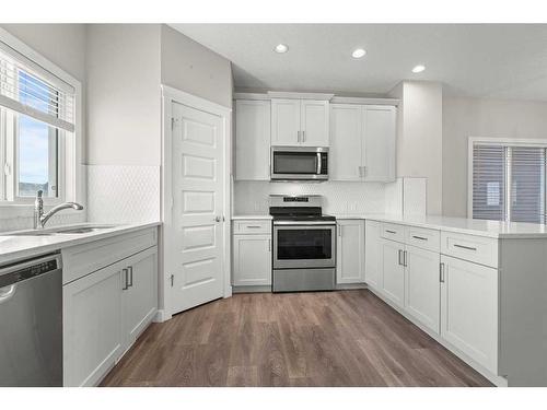 141 Sandstone Drive, Okotoks, AB - Indoor Photo Showing Kitchen With Stainless Steel Kitchen With Upgraded Kitchen