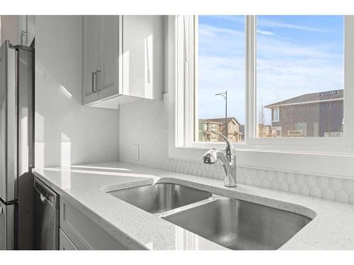 141 Sandstone Drive, Okotoks, AB - Indoor Photo Showing Kitchen With Double Sink