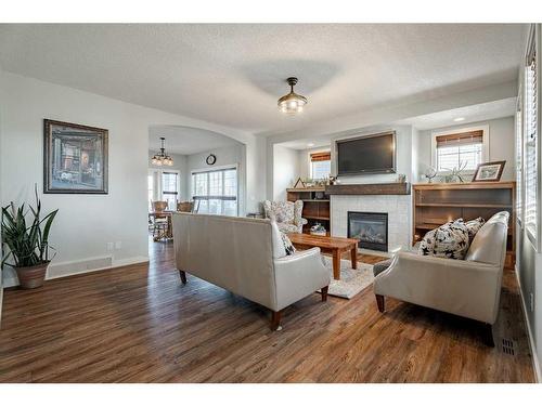 708 Hampshire Way Ne, High River, AB - Indoor Photo Showing Living Room With Fireplace