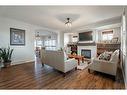 708 Hampshire Way Ne, High River, AB  - Indoor Photo Showing Living Room With Fireplace 