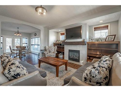 708 Hampshire Way Ne, High River, AB - Indoor Photo Showing Living Room With Fireplace