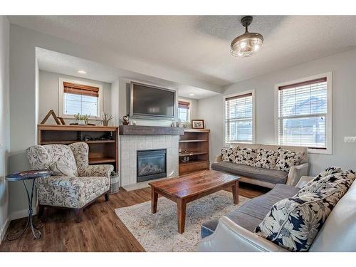 708 Hampshire Way Ne, High River, AB - Indoor Photo Showing Living Room With Fireplace