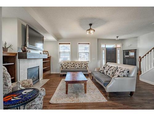 708 Hampshire Way Ne, High River, AB - Indoor Photo Showing Living Room With Fireplace