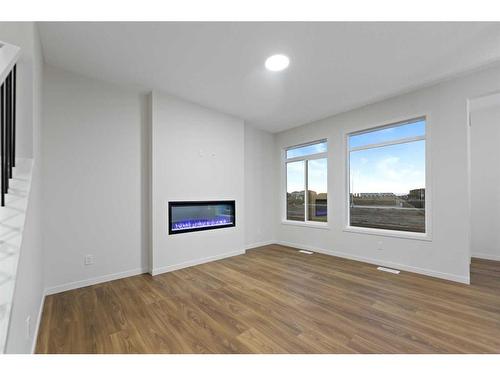 133 Corner Glen Road Ne, Calgary, AB - Indoor Photo Showing Living Room With Fireplace