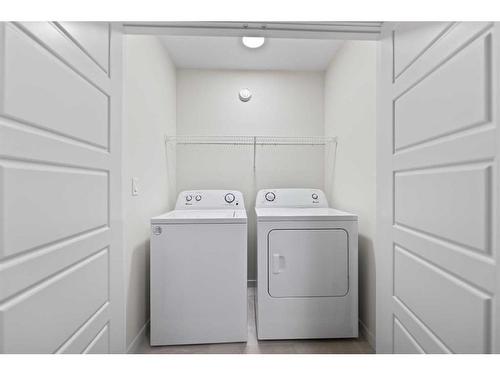 133 Corner Glen Road Ne, Calgary, AB - Indoor Photo Showing Laundry Room