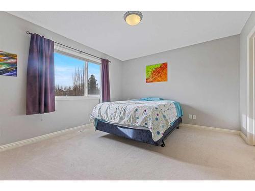 229 Cougar Ridge Drive Sw, Calgary, AB - Indoor Photo Showing Bedroom