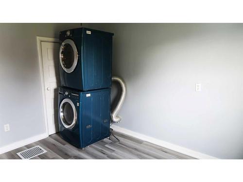 214 8 Street, Beiseker, AB - Indoor Photo Showing Laundry Room