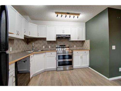 2202-140 Sagewood Boulevard Sw, Airdrie, AB - Indoor Photo Showing Kitchen With Double Sink